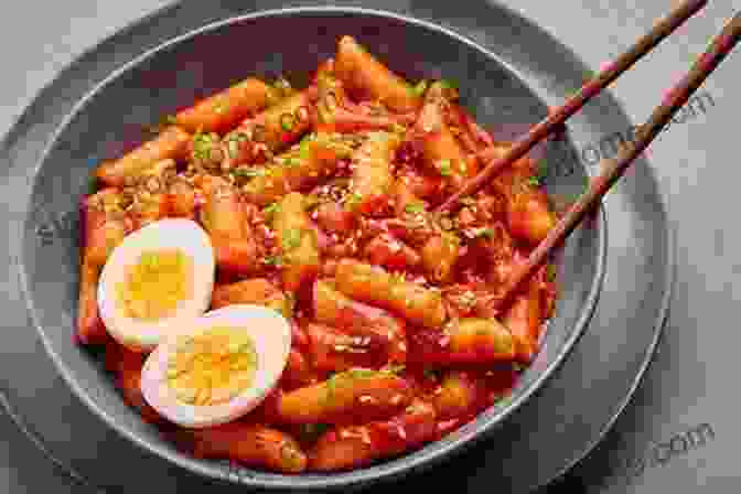 A Mouthwatering Image Of Tteokbokki, Capturing Its Vibrant Red Sauce And Tantalizingly Chewy Rice Cakes. Korean Takeout Cookbook: Favorite Korean Takeout Recipes To Make At Home