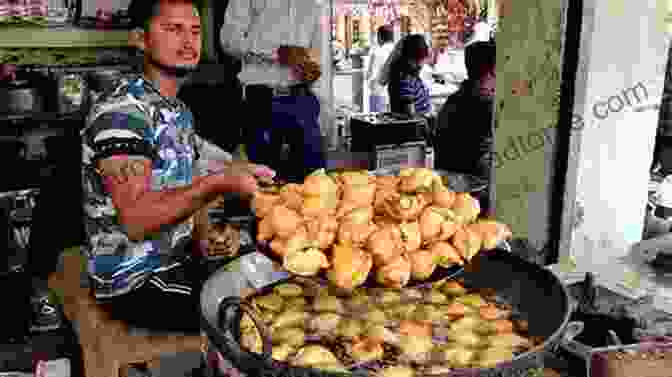 A Photograph Of A Vendor Selling Samosas On A Street In India Whose Samosa Is It Anyway?: The Story Of Where Indian Food Really Came From