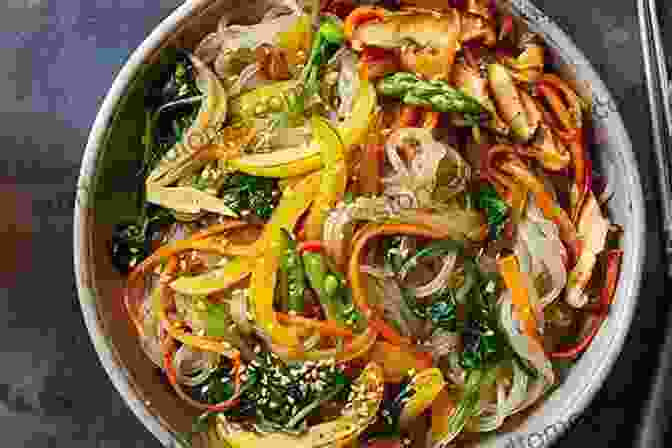 An Enticing Photograph Of Japchae, Showcasing Its Delicate Glass Noodles And Vibrant Vegetables. Korean Takeout Cookbook: Favorite Korean Takeout Recipes To Make At Home