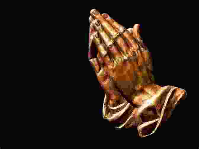 Image Of Hands Clasped In Prayer With A Glowing Cross The Prayer Of The Lord